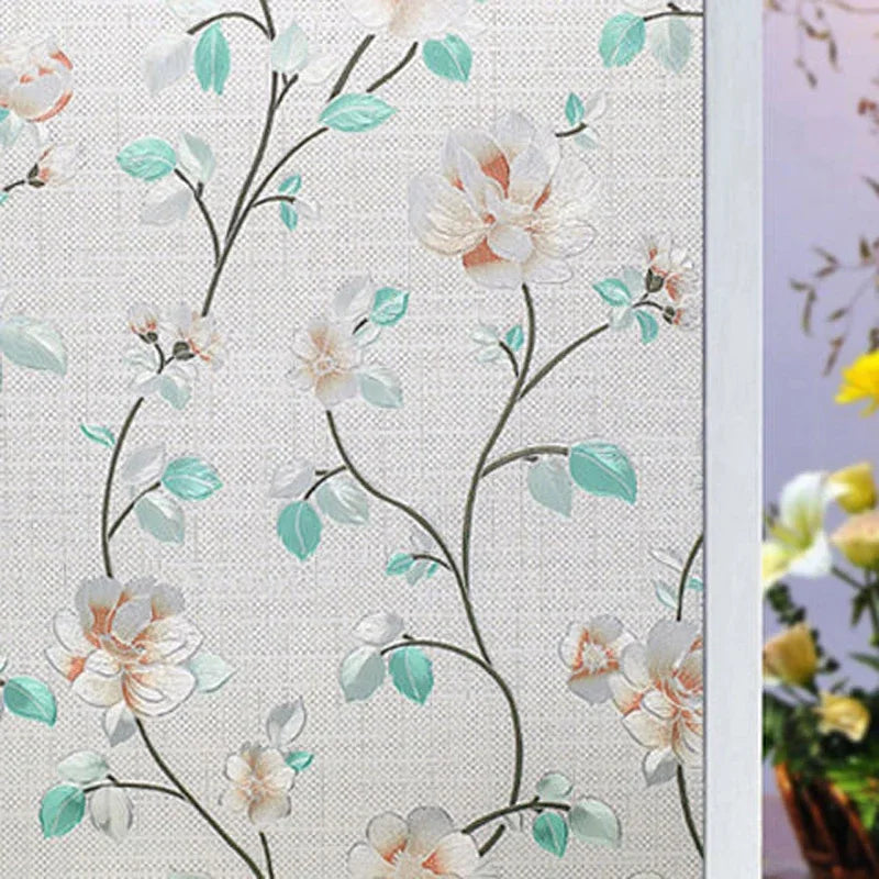 Fönsterfilm med ljusa blommor och turkosa blad