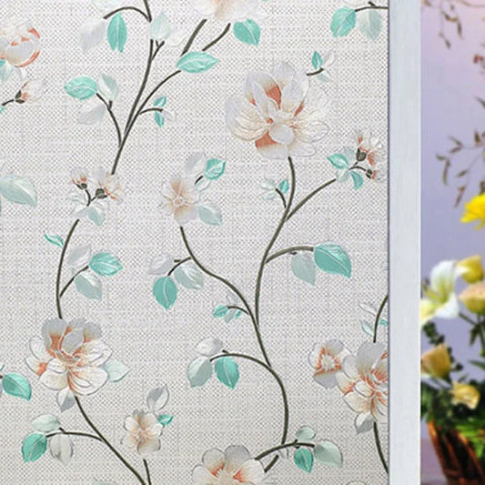 Fönsterfilm med ljusa blommor och turkosa blad